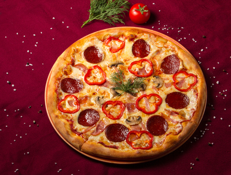 Pizza  on red tableの写真素材