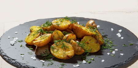 fried potato with skin and coarse saltの写真素材