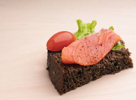 Sandwich with  smoked salmon and salad on white  (estonian bread)の写真素材