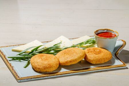 Georgian cakes (mchadi) Mchadi (corn cakes) - a dish of Georgian cuisine on white plateの写真素材