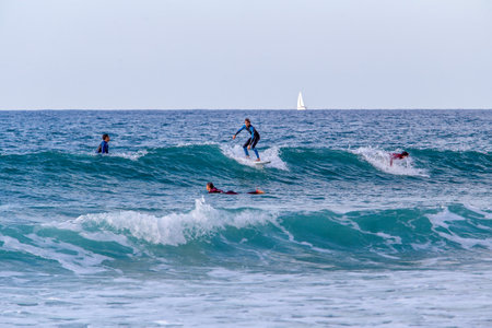 12/25/2014. Tel Aviv, Israel. Young rider - young surfer - teenager- courage! Amazing sunny day - next after Christmas!のeditorial素材