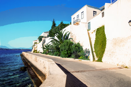 View from ecological road at Spetses - one of fantastic of Greek islands and awesome pink flowering and white wall . There is an amazing place for recreation in southern Europeの写真素材
