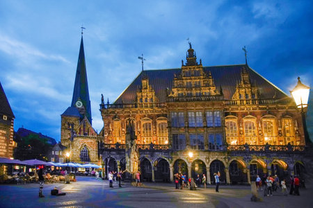 Panorama of Rathaus square and Bremen Rathaus (town hall) people take photos of night city in historical centre- amazing illuminated cityscapeの写真素材