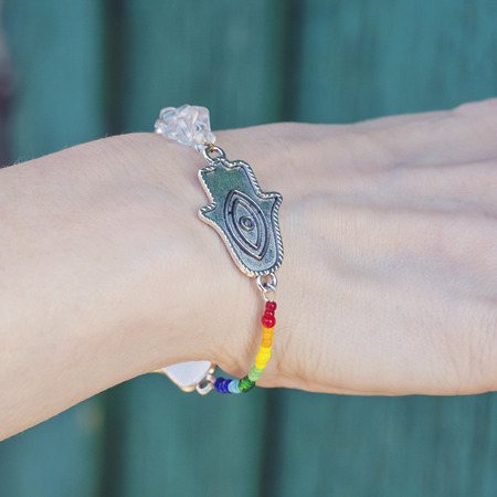 Female hand in yoga posititon with beautiful braceletの写真素材