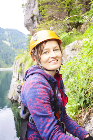 Woman climbing via ferrata, Gosausee, Austriaの写真素材