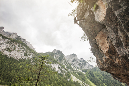 Landscape of Gosau Valley mountain with a male climberの写真素材