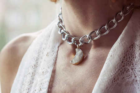 Female necklace with moon shaped pendantの写真素材