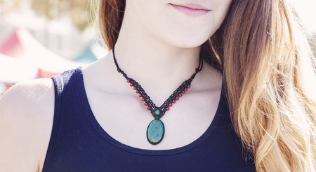 Hand made necklace on female neckの写真素材