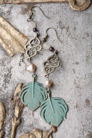 Beautiful earrings and vintage backgroundの写真素材