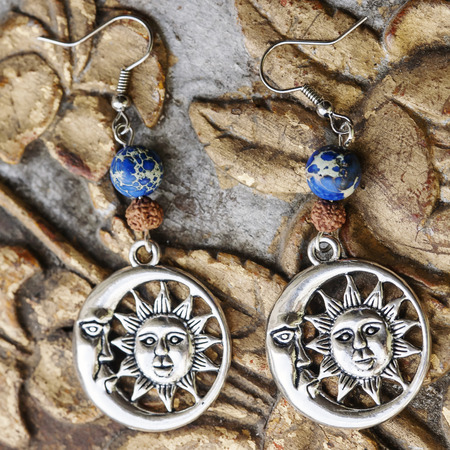 Beautiful earrings and vintage backgroundの写真素材