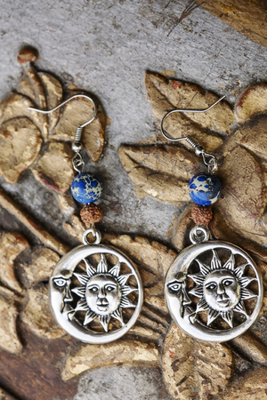 Beautiful earrings and vintage backgroundの写真素材