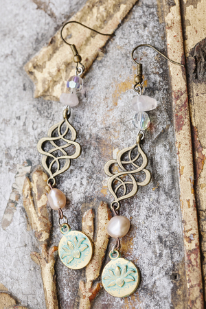 Beautiful earrings and vintage backgroundの写真素材
