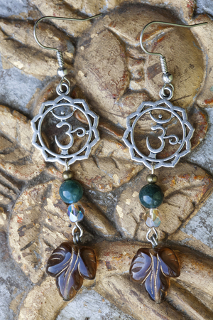 Beautiful earrings and vintage backgroundの写真素材