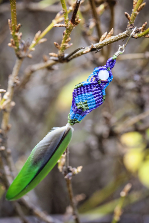 Romantic earrings hanging on natural background
