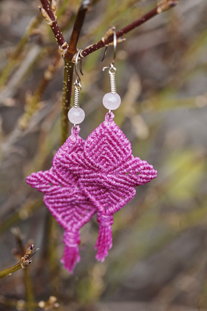 Romantic earrings hanging on natural backgroundの写真素材