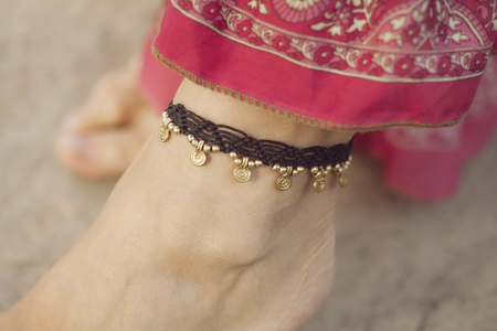 Female ankle with gypsy bracelet