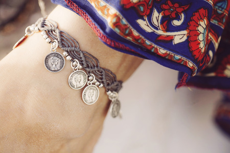 Female ankle with gypsy bracelet