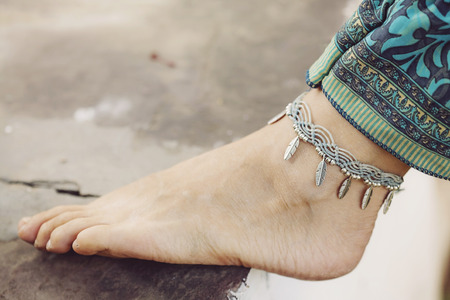 Female ankle with gypsy bracelet