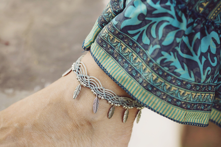 Female ankle with gypsy bracelet