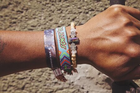Prague, Czech Republic, June 29, 2018: Male hand with attend music festival member bracelets, Illustrative editorialのeditorial素材