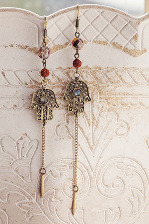 Oriental metal earrings with labradorite stoneの写真素材