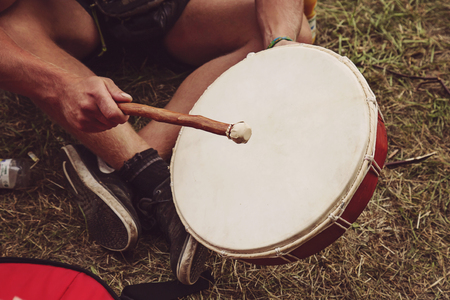 Shamanic drum player hands in actionの写真素材