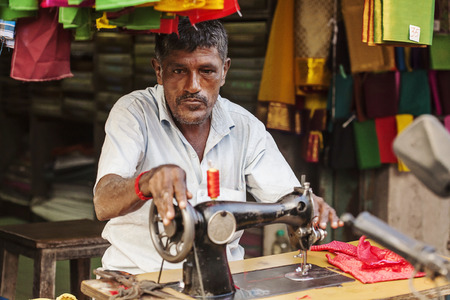 Udaipur, Rajasthan, India, January 31, 2018: Tailor at public city market