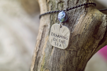 Natural fashionable Bracelet on wooden backgroundの写真素材