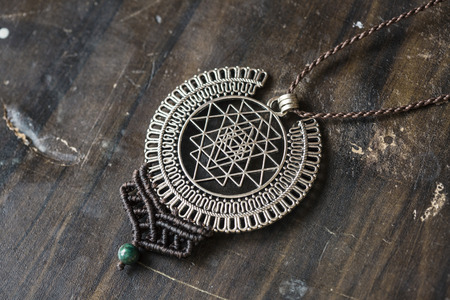 Sacred geometry metal pendant necklace with chrysokol stone beadの写真素材