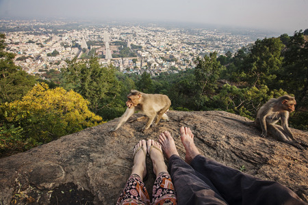 Couple legs sitting at Arunachala mountain view, Tiruvannamalai, Tamil Nadu, Indiaの写真素材