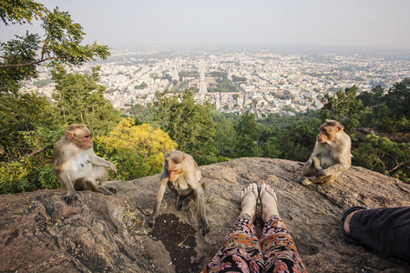 Couple legs sitting at Arunachala mountain view, Tiruvannamalai, Tamil Nadu, Indiaの写真素材