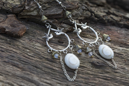 Metal earrings with natural componentsの写真素材