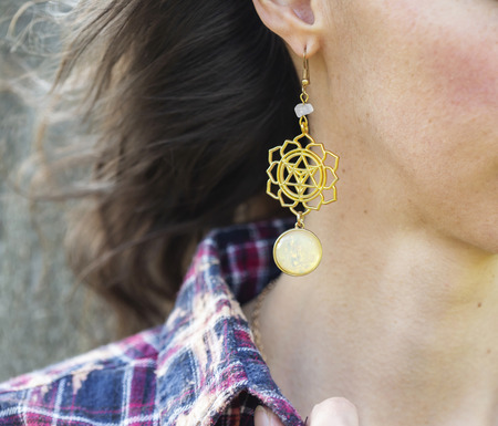 Merkabah Metatron symbol metal earrings on female ear