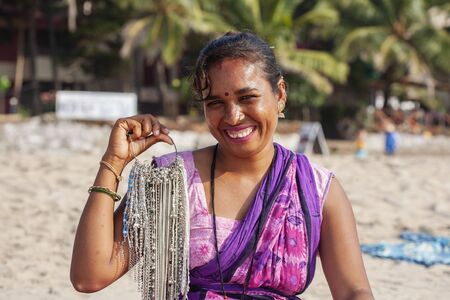 Gokarna in India, January 15, 2018: Indian woman jewelry seller portrait at Kudli beach resort in Gokarna cityのeditorial素材
