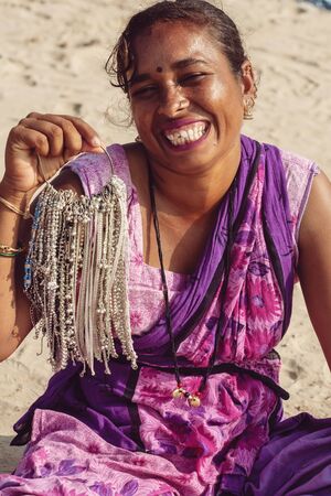 Gokarna in India, January 15, 2018: Indian woman jewelry seller portrait at Kudli beach resort in Gokarna cityのeditorial素材