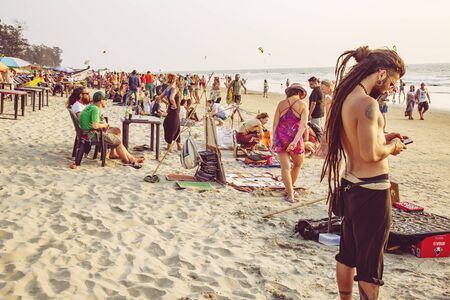 Arambol, Goa, India, February 1, 2019: Souvenir sellers on Arambol beach at the sunsetのeditorial素材