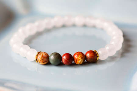 Mineral stone bracelet on white decorative background