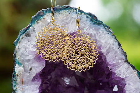 Brass metal boho style Indian earringsの写真素材