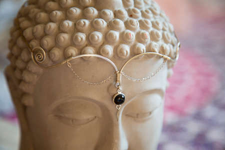 Lotus pendant larimar gemstone natural beads bracelet on grey rocky backgroundの写真素材