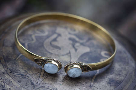 Brass metal boho bracelet with moon stoneの写真素材