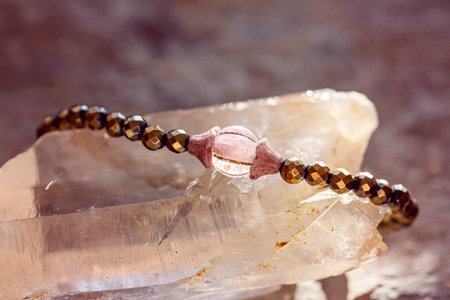 Mineral gemstone bracelet placed on natural grey backgroundの写真素材