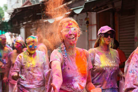 Pushkar in Rajasthan, India, 10th of March 2020: People celebrating Holi festival throwing colors...