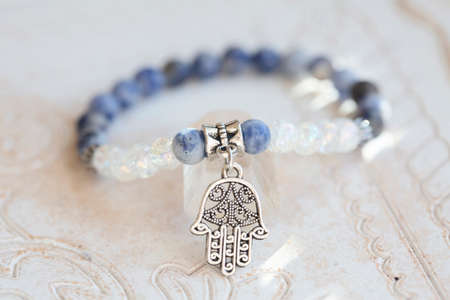 Mineral stone beads yoga bracelet on neutral natural backgroundの写真素材