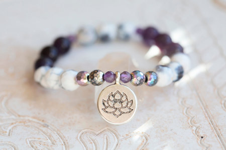 Mineral stone beads yoga bracelet on neutral natural backgroundの写真素材