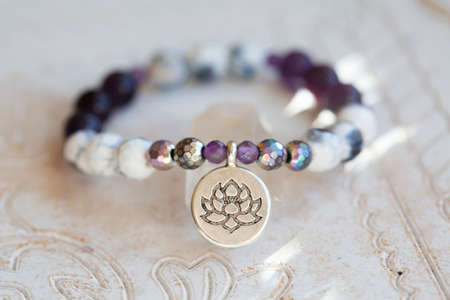Mineral stone beads yoga bracelet on neutral natural backgroundの写真素材