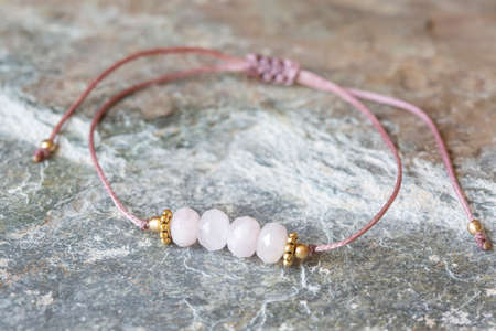 Rose quartz cubic cut mineral stone bead bracelet on natural backgroundの写真素材
