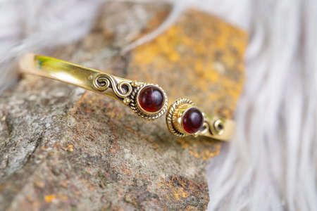 Brass bracelet with mineral gemstone decorative detail for womanの写真素材