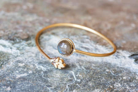 Brass bracelet with mineral gemstone decorative detail for womanの写真素材
