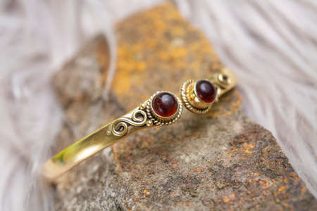 Brass bracelet with mineral gemstone decorative detail for womanの写真素材