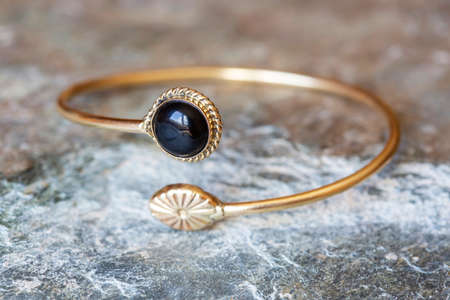 Brass bracelet with mineral gemstone decorative detail for womanの写真素材